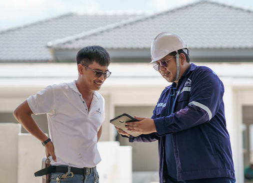 two people finalising a solar project on site